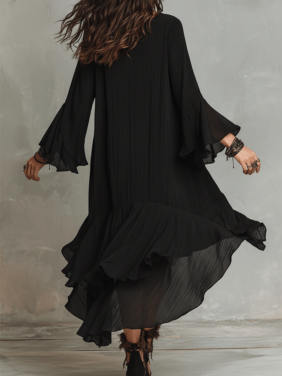 Elegante vestido midi bohemio negro asimétrico con pliegues